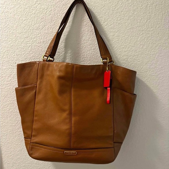 Coach Handbags - Coach Tan Leather Tote with Red Charm Accent